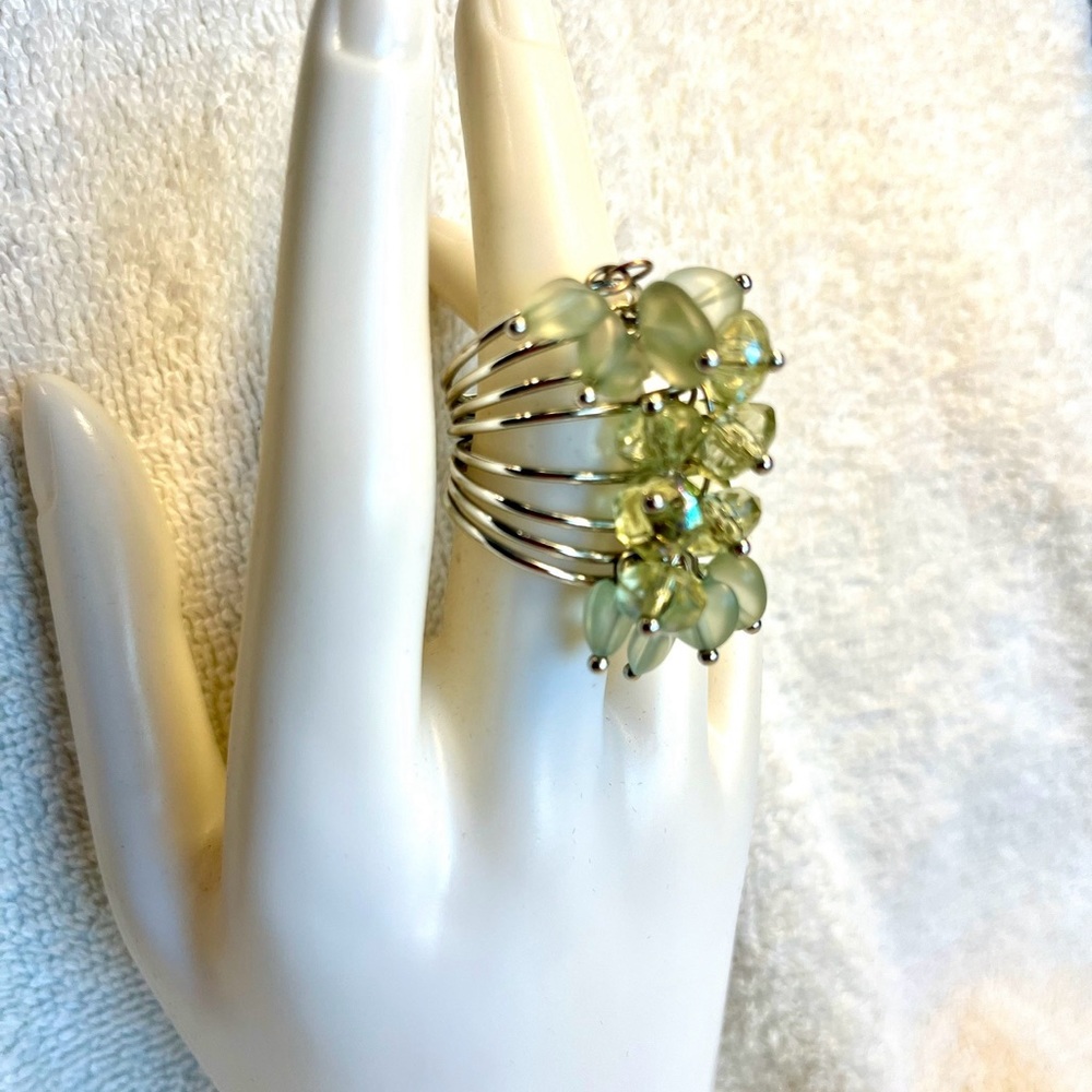 Silver and light green beads “power” ring
